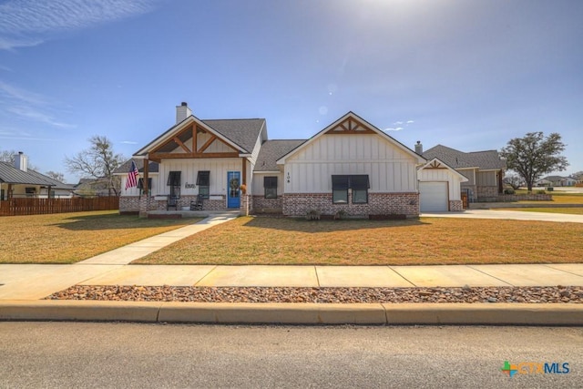 craftsman-style home with board and batten siding and a front yard