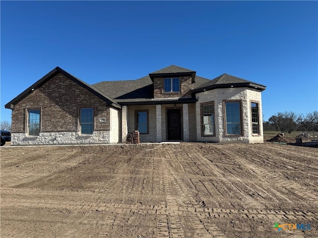 view of front of home with brick siding