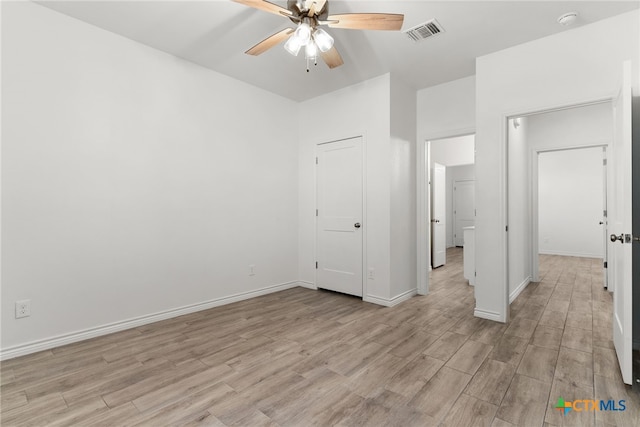 unfurnished bedroom featuring light hardwood / wood-style floors and ceiling fan