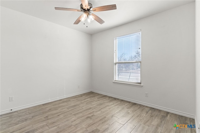 empty room with ceiling fan and light wood-type flooring