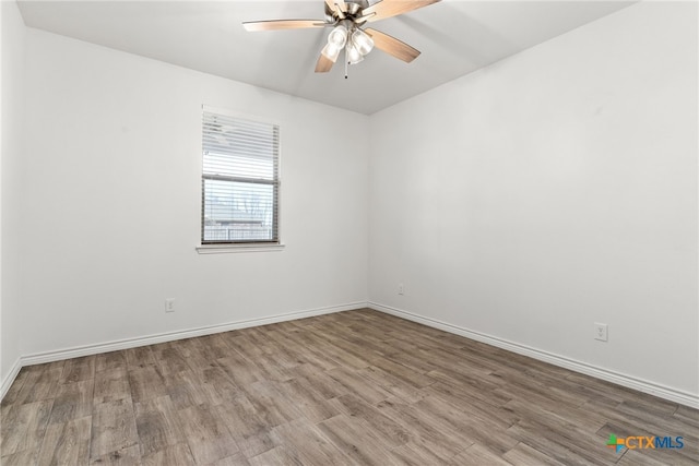 unfurnished room with wood-type flooring and ceiling fan