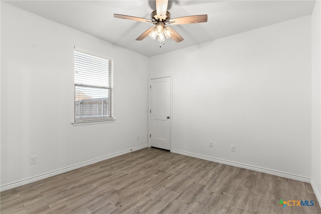 spare room with ceiling fan and light hardwood / wood-style floors