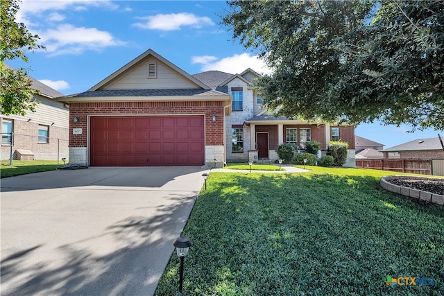 view of front facade featuring a garage and a front lawn