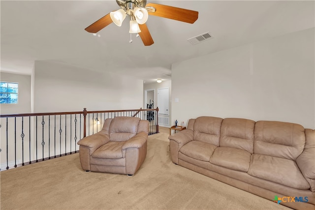 living room featuring ceiling fan and light colored carpet