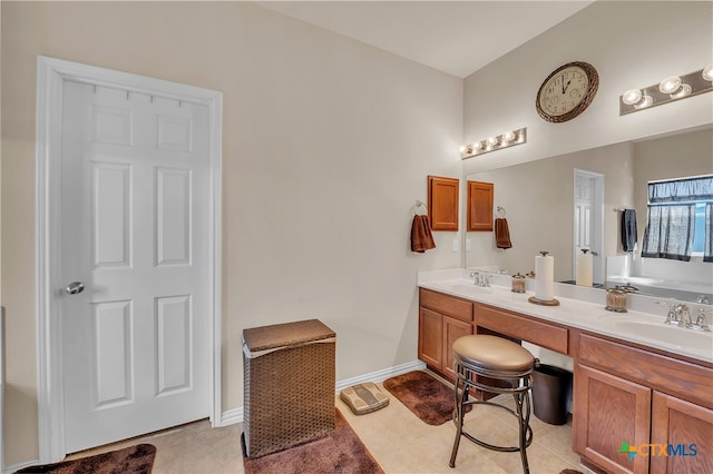 bathroom featuring tile patterned floors and vanity