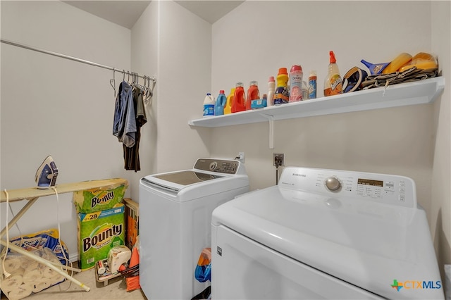 laundry area with independent washer and dryer