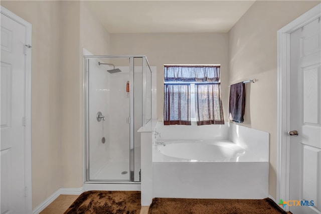 bathroom featuring separate shower and tub and tile patterned floors