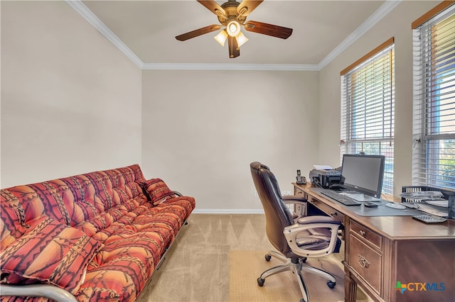 office space with a healthy amount of sunlight, crown molding, and light carpet