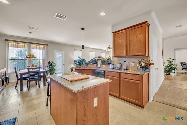 kitchen with ceiling fan, black dishwasher, kitchen peninsula, decorative light fixtures, and decorative backsplash