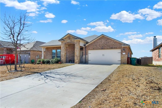 ranch-style home featuring a garage