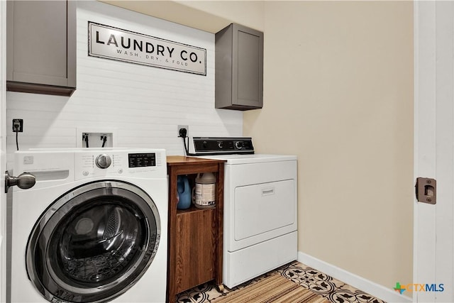 laundry room with cabinets and independent washer and dryer