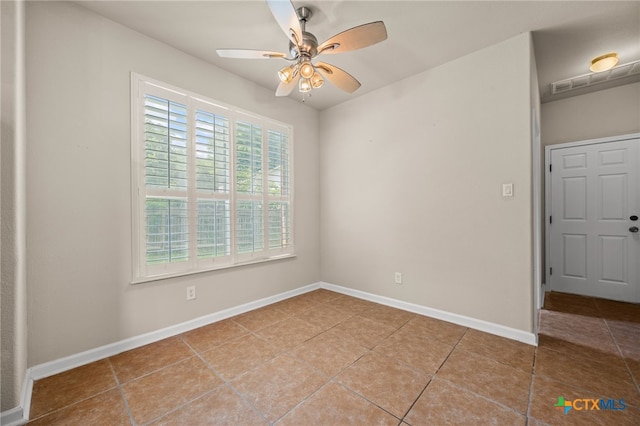 1018 Canyon Maple Rd, Pflugerville, TX 78660 - tiled spare room with a ceiling fan and baseboards