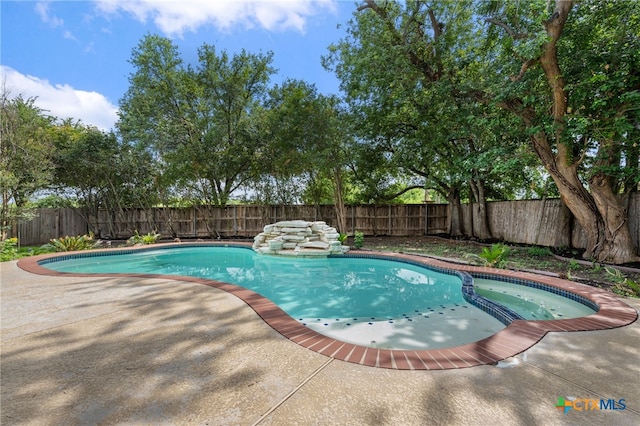 1018 Canyon Maple Rd, Pflugerville, TX 78660 - view of pool featuring a fenced backyard, a patio, and a pool with connected hot tub