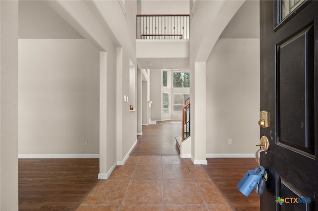 1018 Canyon Maple Rd, Pflugerville, TX 78660 - foyer entrance featuring baseboards, wood finished floors, and a high ceiling