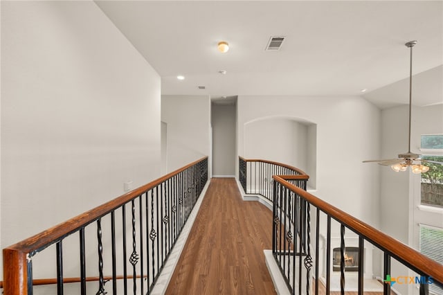 1018 Canyon Maple Rd, Pflugerville, TX 78660 - hall with an upstairs landing, wood finished floors, recessed lighting, and lofted ceiling