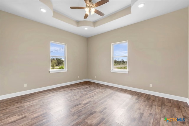 empty room featuring hardwood / wood-style floors and a healthy amount of sunlight