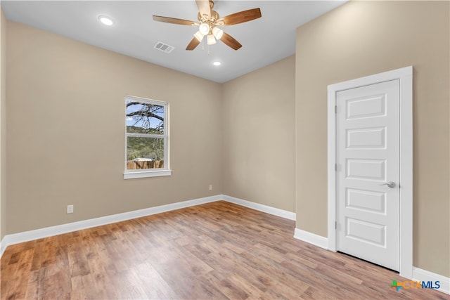 unfurnished room featuring light hardwood / wood-style floors and ceiling fan