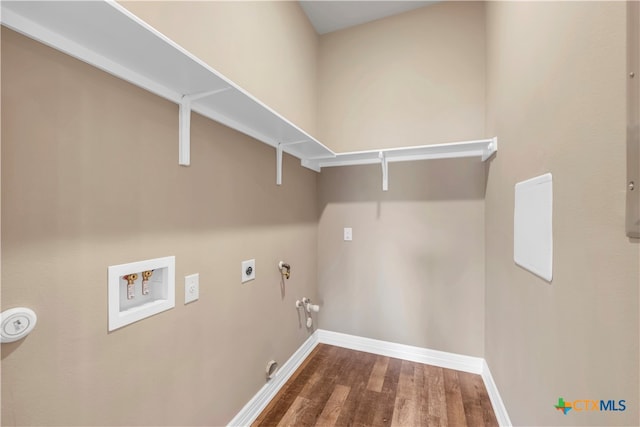 laundry room with hookup for a washing machine, hookup for a gas dryer, dark hardwood / wood-style floors, and hookup for an electric dryer