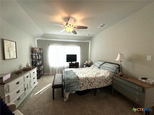 bedroom with ceiling fan, light carpet, and vaulted ceiling