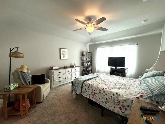 carpeted bedroom featuring ceiling fan and lofted ceiling