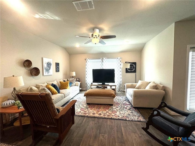 living room with dark hardwood / wood-style floors, ceiling fan, and lofted ceiling