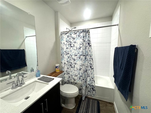 full bathroom featuring shower / bath combo with shower curtain, vanity, wood-type flooring, and toilet