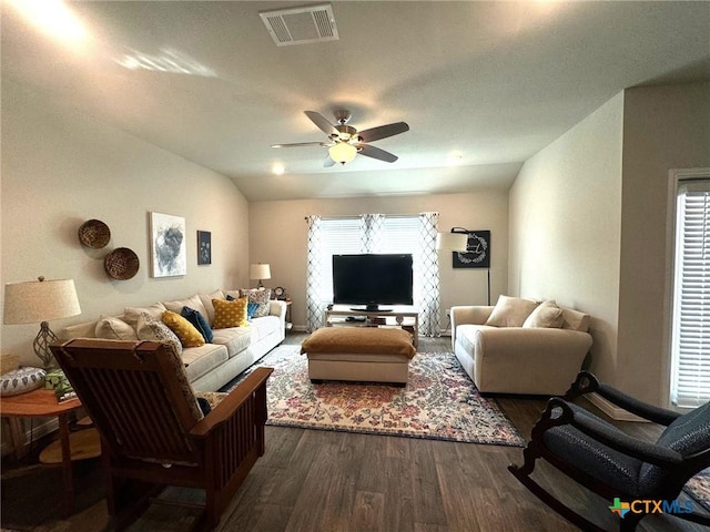 living room with lofted ceiling, ceiling fan, and dark hardwood / wood-style floors