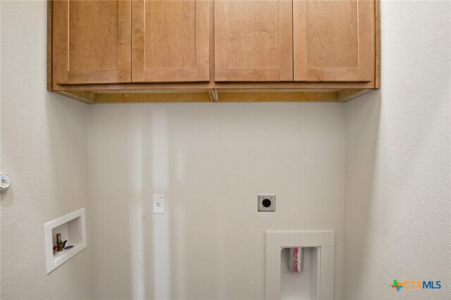 clothes washing area featuring washer hookup, hookup for an electric dryer, and cabinet space