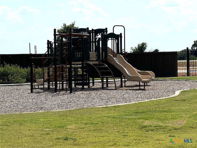 248 Teller Dr, Lockhart, TX 78644 - communal playground with a lawn and fence