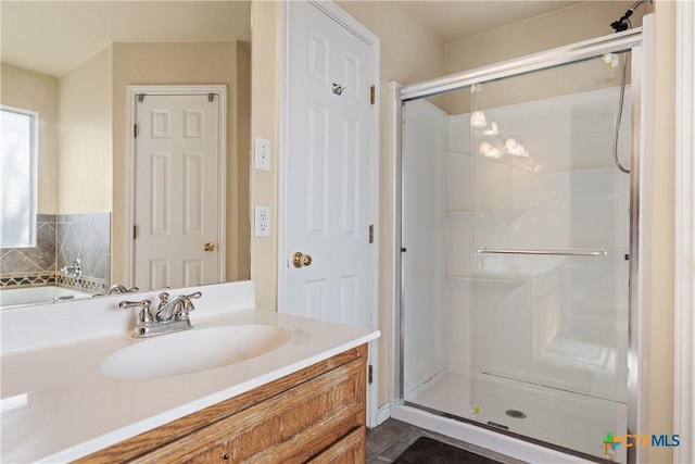 bathroom featuring backsplash, vanity, and walk in shower