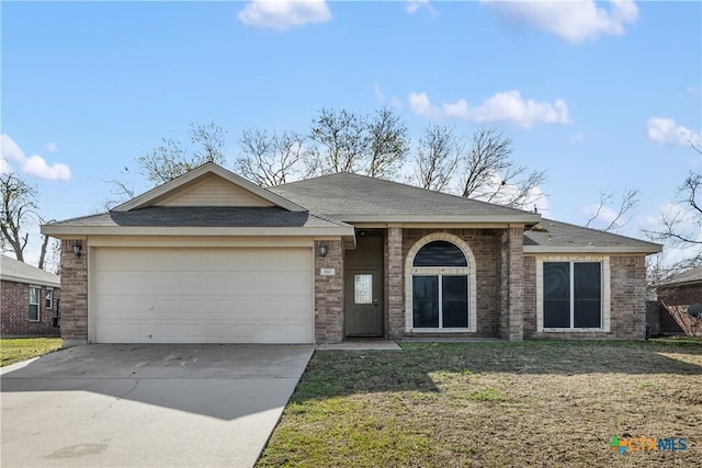 ranch-style house featuring a front yard and a garage