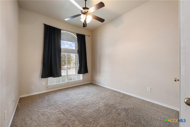 empty room with carpet flooring and ceiling fan