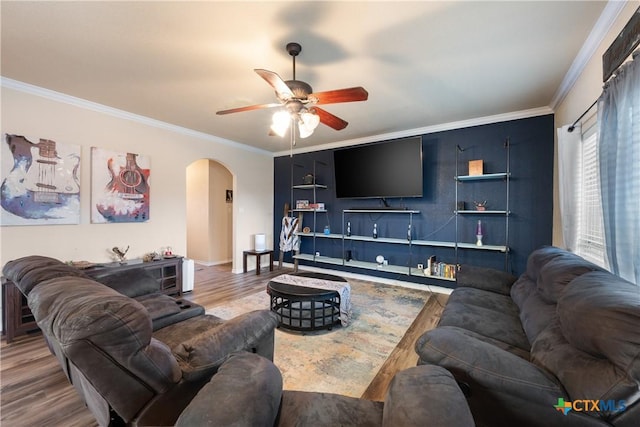 living room with hardwood / wood-style floors, ceiling fan, and crown molding