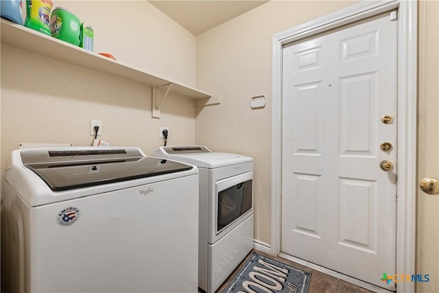 laundry room with tile patterned floors and washer and dryer