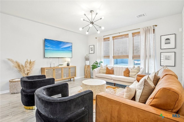 living room with a notable chandelier