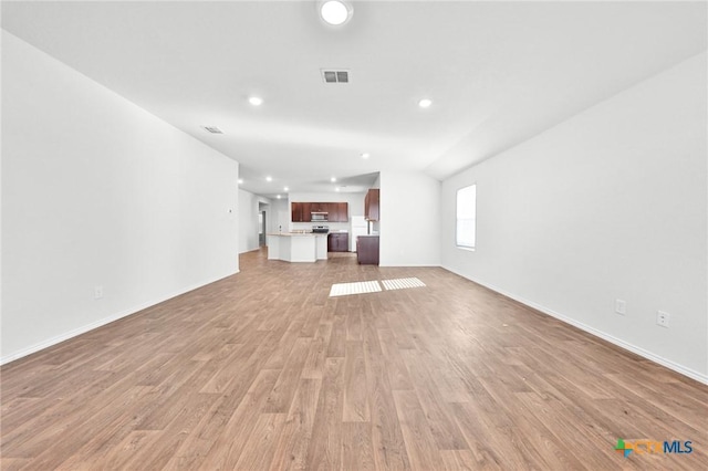 813 Indigo Way, Seguin, TX 78155 - unfurnished living room featuring light wood finished floors, recessed lighting, and baseboards