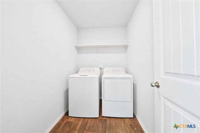 813 Indigo Way, Seguin, TX 78155 - laundry room with washing machine and dryer, wood finished floors, and baseboards