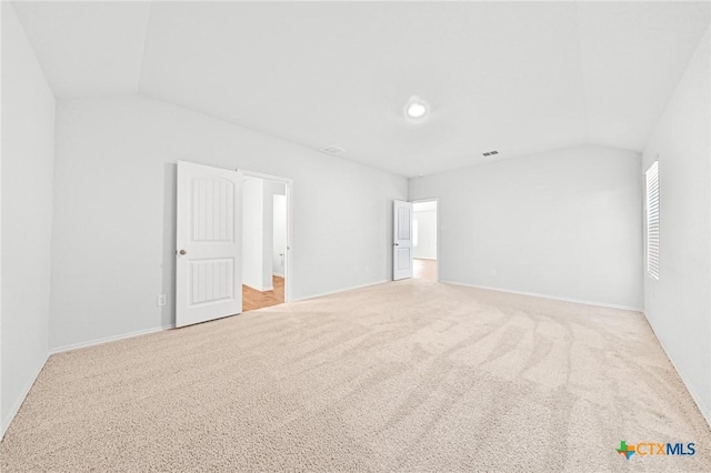 813 Indigo Way, Seguin, TX 78155 - bonus room featuring lofted ceiling, carpet floors, and baseboards
