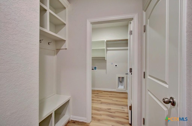 mudroom with light hardwood / wood-style floors