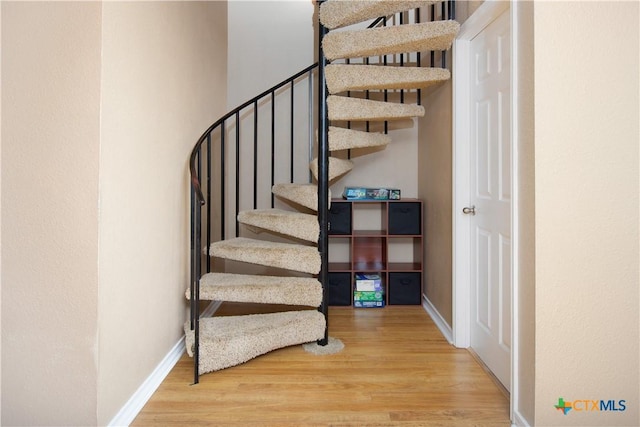 461 Naked Indian Trl, New Braunfels, TX 78132 - stairs featuring wood finished floors and baseboards