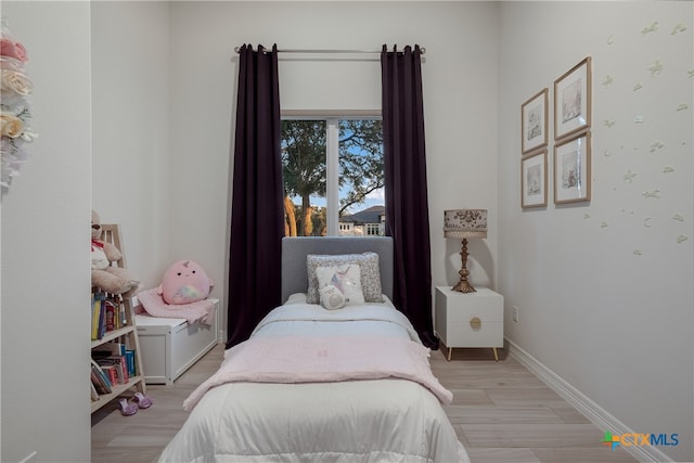 bedroom featuring light wood-type flooring