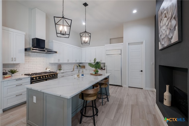 kitchen with sink, high quality appliances, and white cabinets