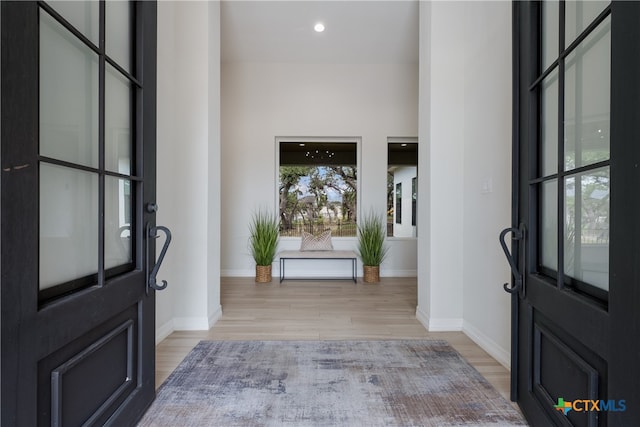 foyer with light wood-type flooring