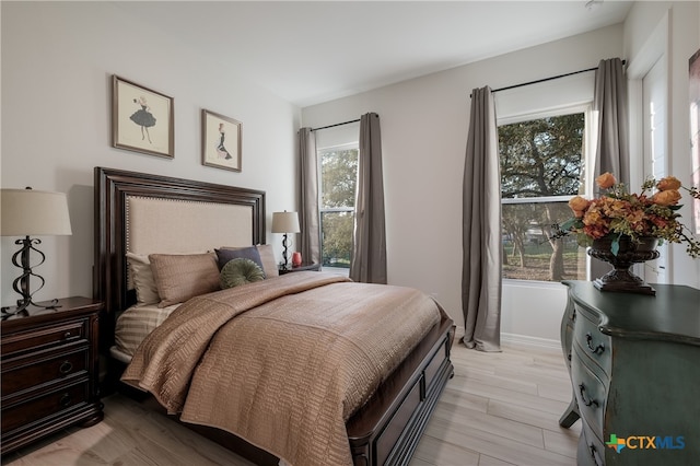 bedroom with light hardwood / wood-style floors