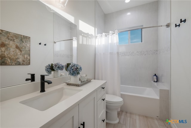 full bathroom with vanity, toilet, and shower / tub combo