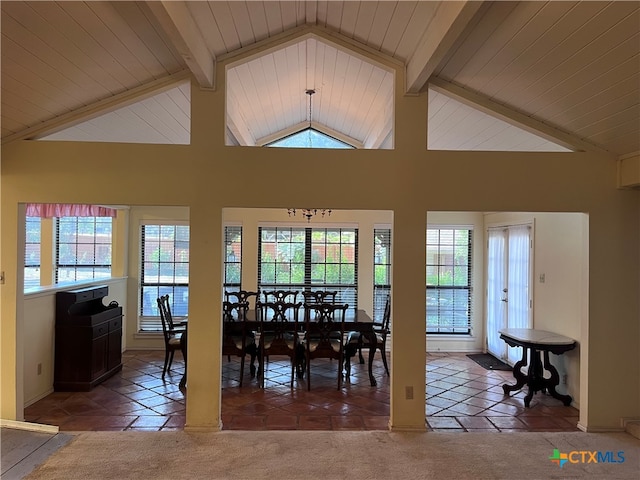 carpeted dining space with high vaulted ceiling and beam ceiling