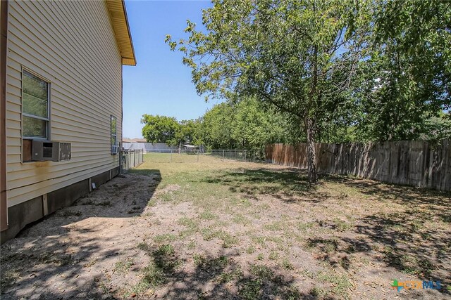 1124 E Kingsbury St Unit B, Seguin, TX 78155 - fenced backyard featuring cooling unit