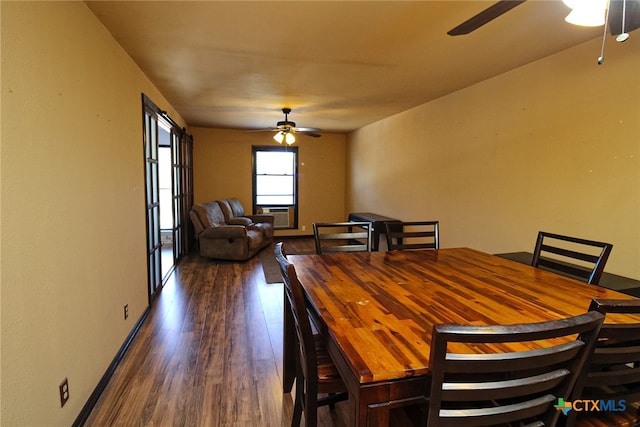 dining room featuring dark wood-type flooring and ceiling fan