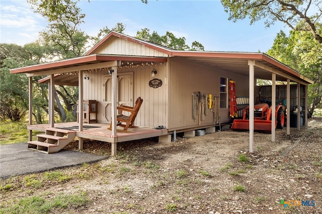 29720 Twin Creeks Dr, Bulverde, TX 78163 - view of side of home featuring a carport and a deck