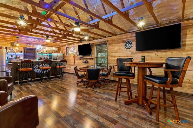 29720 Twin Creeks Dr, Bulverde, TX 78163 - dining room with a bar, ceiling fan, wood finished floors, and wooden walls
